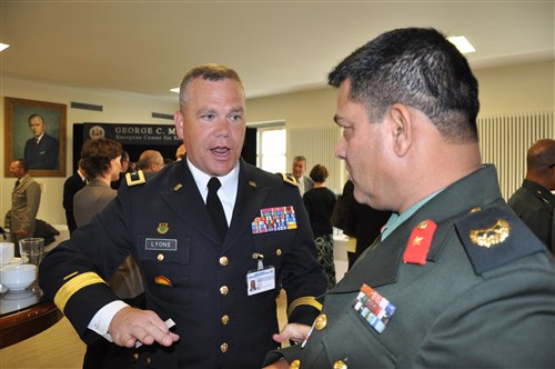 Army Brig. Gen. Judd Henry Lyons, adjutant general for the Nebraska National Guard, talks with Nepalese Brig. Gen. Suresh Sharma during the opening of the Senior Executive Seminar Sept. 5. The seminar lasts from Sept. 5-12 and discusses countering violent extremism.