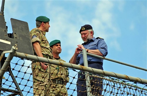 British Royal navy Rear Adm. Timothy Lowe, right, deputy commander, Naval Striking and Support Forces NATO, speaks with British Royal Marines on board the amphibious command ship USS Mount Whitney (LCC 20) at the conclusion of exercise Baltic Operations (BALTOPS) 2013. Now in its 41st year, BALTOPS 2013 is an annual multinational exercise to enhance maritime capabilities and interoperability with partner nations to promote maritime safety and security in the Baltic Sea.