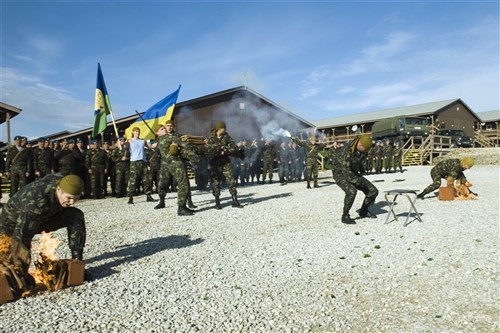 Ukraine soldiers from the 79th Airmobile Brigade go all out to conclude a martial arts demonstration on Dec. 6, Ukraine Armed Forces Day, on Camp Bondsteel, Kosovo. The 79th Airmobile Brigade is an elite paratrooper unit with specialized training in hand-to-hand combat. 