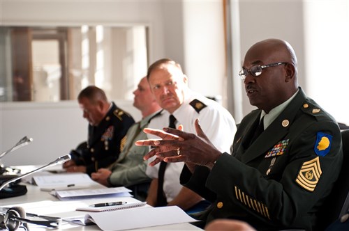 GARMISH, Germany - Command Sgt. Maj. Howard Robinson (right), senior enlisted leader of the Illinois National Guard, speaks to an assembled group of fellow senior enlisted leaders during a NATO noncommissioned officer strategy session designed to promote NCO Corps professional development, Sept. 10. Bringing together 32 nations at the George C. Marshall European Center for International Studies in Garmisch, Germany, the International Senior Enlisted Seminar 2012 is the flagship professional development event for NATO, Partnership for Peace and key contact nation senior enlisted leaders, helping to prepare them for increasingly complex and challenging multinational environments, while continuing the development of a professional NCO Corps in NATO and partnered countries.