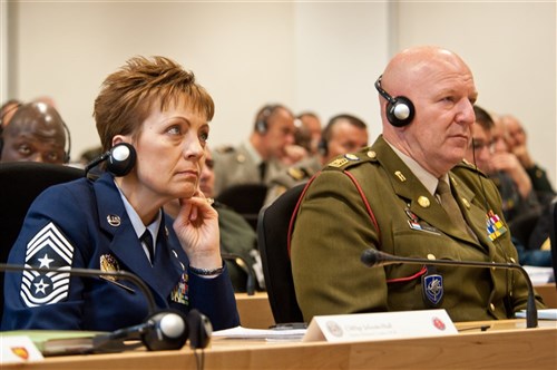 GARMISH, Germany - Chief Master Sgt. Denis Jelinski-Hall (left), senior enlisted leader to the Chief of the U.S. National Guard Bureau, and Adjutant Major Claude Schmitz, regimental sergeant major of the NATO School, takes part in a video teleconference briefing given by Command Sgt. Maj. Sofi Roshan, senior enlisted leader of the Afghan National Army. Roshan spoke on the current status of Afghan forces, then moved on to an open discussion with the 2012 International Senior Enlisted Seminar attendees, Sept. 12. Bringing together 32 nations at the George C. Marshall European Center for International Studies, ISES is the flagship professional development event for NATO, Partnership for Peace and key contact nation senior enlisted leaders, helping to prepare them for increasingly complex and challenging multinational environments, while continuing the development of a professional NCO Corps in NATO and partnered countries.