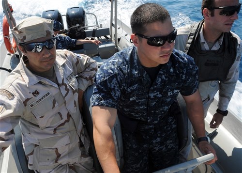 SOUDA BAY, Crete (May 30, 2011)  -- Boatswain's Mate Third Class Anthony Woo, a coxswain serving aboard USS Robert G. Bradley (FFG 49), maneuvers a double-engined rigid-hulled inflatable boat (RHIB) during a RHIB evolution under the training of coxswains from the Greek armed forces during Phoenix Express 2011. The training teaches junior coxswains how to maneuver efficiently a RHIB alongside a vessel suspected of carrying suspicious cargo for the Bradley&#39;s Visit, Board, Search and Seizure team to climb successfully aboard. PE-11, a three-week exercise divided into in-port and underway training phases, is designed to enhance regional maritime partnerships among the 13 participating countries in their efforts to deter illicit trafficking at sea. (U.S. Navy photo by Mass Communication Specialist 2nd Class (SW) Jeff Troutman/Released)