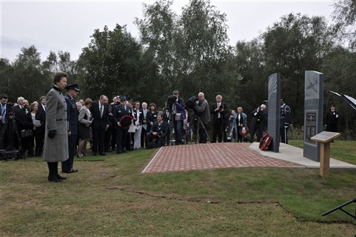 GREENHAM COMMON, United Kingdom – Her Royal Highness, Princess Anne, The Princess Royal and Col. Brian Kelly, 501st Combat Support Wing commander, pause for a moment of silence to honor the American servicemen who were based locally and lost their lives during World War II. Her Royal Highness dedicated three memorial stones for U.S. Visiting Forces at the Greenham Business Park in Greenham Common, United Kingdom, Sept. 21. The three-part memorial is in remembrance of 16 service members killed when two B-17 Flying Fortresses collided above Greenham Common Dec. 15, 1944; 33 Airmen who died just three days earlier when their Horsa Glider crashed on takeoff at the base; and American servicemen who were based locally and lost their lives during World War II. 