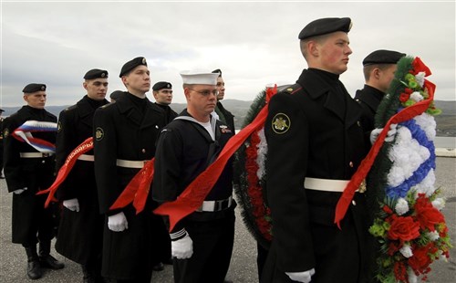 MURMANSK, Russia (Sep. 7, 2010) - Fire Controlman 2nd Class Justin Sanders, a color guard member stationed aboard USS Taylor (FFG 50), prepares to lay a wreath at the Alyosha World War II Monument alongside members of the Russian Armed Forces to honor the fallen soldiers of World War II. Taylor is in
Murmansk to celebrate the close World War II alliance between Russia and the U.S., and to honor veterans in both countries on the 65th anniversary of the end of World War II. Taylor, an Oliver Hazard Perry-class frigate homeported in Mayport, Fla., is on a scheduled deployment in the U.S. 6th Fleet area of responsibility. (U.S. Navy photo by Mass Communication Specialist 1st Class Edward
Kessler/Released)