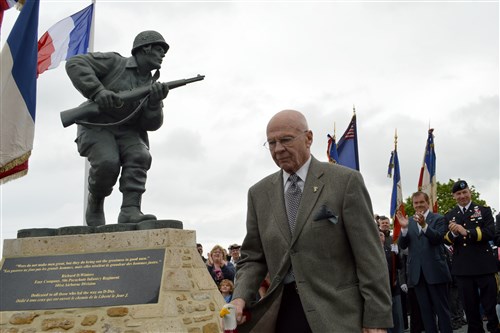 Former Homeland Security Director Tom Ridge and Maj. Gen. Jim McConville, commander of the 101st Airborne Division (Air Assault), watch as, dedicated June 6, 2012 near Utah Beach in Normandy.