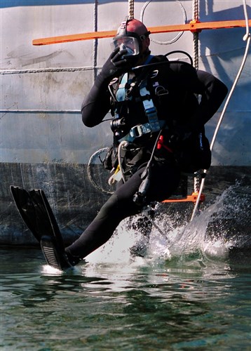 ODESSA, Ukraine - Navy Diver 2nd Class Alex Hardy jumps into the water during a combined-diving demonstration as part of Exercise Sea Breeze 2012 (SB12). SB12, co-hosted by the Ukrainian and U.S. navies, aims to improve maritime safety, security and stability engagements in the Black Sea by enhancing the capabilities of Partnership for Peace and Black Sea regional maritime security forces. 