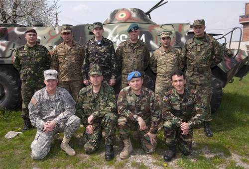 Members of all 10 nations pose for a group photo during Saber Guardian 2013, a U.S. European Command Black Sea regional exercise planned and executed by Romanian Land Forces and U.S. Army Europe.  This is the first time these Black Sea regional countries (Romania, Bulgaria, Armenia, Azerbaijan, Republic of Georgia, Moldova, and Ukraine) have come together to train and exercise their battlestaff and command post procedures at one location.  Serbian and Polish Land Forces are also participating to enhance their relationships with these Black Sea countries.  There are more than 150 training audience members, support staff and contractors supporting the training at the Romanian Land Forces Combat Training Center in Cincu, Romania from 15-25 April. 