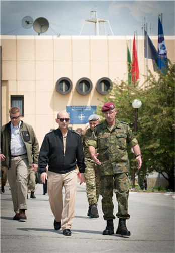Admiral James Stavridis (left), Supreme Allied Commander Europe, walks with Major General Volker Halbauer (right), Commander Kosovo Force, at HQ Camp Film City, Pristina, Kosovo, during SACEURs visit to Kosovo on May 1, 2013. 