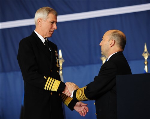 NAPLES, Italy (Feb. 24, 2012) - Adm. James Stavridis, Supreme Allied Commander, Europe, and Commander, U.S. European Command, shakes hands with Adm. Samuel J. Locklear III after presenting the NATO Meritorious Service Medal, at today's change of command ceremony on Naval Support Activity Naples. During the ceremony, Adm. Bruce W. Clingan relieved Locklear as Commander, U.S. Naval Forces Europe-Africa and Commander, Allied Joint Forces Command. 