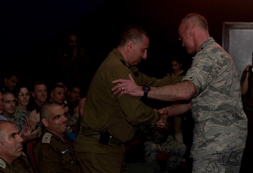 U.S. Air Force Lt. Gen. Craig Franklin shakes hands with Israeli Brig. Gen. Shachar Shohat during the opening ceremony of Austere Challenge 2012. 10th AAMDC soldiers participate in the joint Austere Challenge 2012 Exercise with Israeli Defense Forces to develop partnered air and missile defense capabilities.