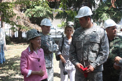 Mary Burce Warlick (left), U.S. ambassador to Serbia, asks 1st Lt. Roger Nienberg a question Aug. 8, 2012, at the Svetozar Markovic Primary School in Kraljevo, Serbia. Warlick visited Ohio National Guard and Serbian Armed Forces engineers working at the school, which was damaged by an earthquake in 2010. 