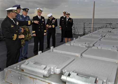CUTLINE: DEN HELDER, Netherlands (Oct. 18, 2010) Cmdr. Mark Oberley, commanding officer USS Stout (DDG 55), explains the capabilities of the aft vertical launch system to Rear Adm. Gerard P. Hueber,(center), U.S. Naval Forces Europe-Africa, director of policy, resources and strategy, and guests from the Royal Netherlands Navy and Air Force during a tour. Stout visited the Netherlands for a port visit and a cooperative engagement with the Royal Netherlands Navy, Marine Corps and Air Force on theater security. (U.S. Navy photo by Mass Communication Specialist Seaman Anna Wade/RELEASED)
