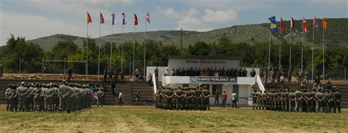 Participants of Shared Resilience 2012 stand in formation during the exercise opening ceremony here May 28, 2012. More than 500 military members from nine nations are participating in the annual U.S. Joint Chiefs of Staff sponsored exercise May 28 - June 8. The goals of the exercise are to strengthen interoperability, facilitate training in crisis response and disaster management, and validate the readiness of deployable military medical and humanitarian assistance teams. The exercise, in the spirit of partnership for peace, directly supports U.S. European Command's theater cooperation efforts and strategy for active security with European countries.