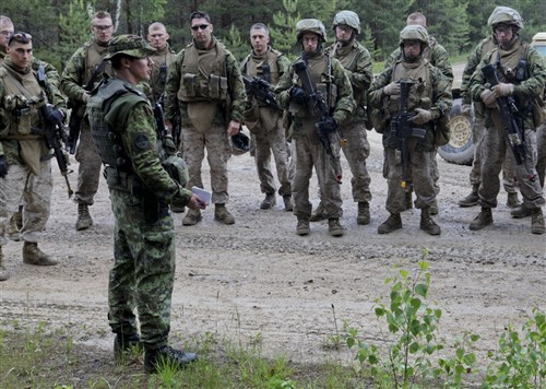 ADAZI, LATIVA – Estonian Army 1st Lt. Denis Borzeniw, convoy operation instructor, debriefs the U.S. Marine 3rd Platoon, 3rd Battalion, 25th Marine Regiment, at the end of a Saber Strike convoy operation exercise. Saber Strike is a USAREUR-led theater security cooperation exercise conducted in the Baltic States (Estonia, Latvia and Lithuania). The exercise focuses on command and control (C2), as well as interoperability. 