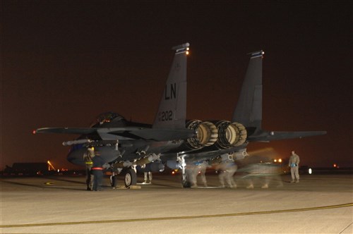 ROYAL AIR FORCE LAKENHEATH, England (March 20, 2011) - Maintainers from the 48th Aircraft Maintenance Squadron make final checks on an F-15E Strike Eagle prior to departing RAF Lakenheath, England.  Units from the 48th Fighter Wing deployed in support of Operation Odyssey Dawn. The 48th Fighter Wing provides all-weather, day or night air superiority and air-to-ground precision combat capability as well as combat search and rescue.  Joint Task Force Odyssey Dawn is the U.S. Africa Command task force established to provide operational and tactical command and control of U.S. military forces supporting the international response to the unrest in Libya and enforcement of United Nations Security Council Resolution (UNSCR) 1973.  UNSCR 1973 authorizes all necessary measures to protect civilians in Libya under threat of attack by Qadhafi regime forces. JTF Odyssey Dawn is commanded by U.S. Navy Adm. Sam Locklear. (U.S. Air Force photo by Tech. Sgt. Lee A. Osberry Jr./Released)