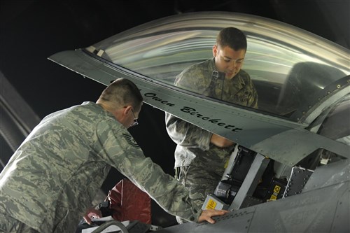 SPANGDAHLEM AIR BASE, Germany (March 17, 2011) -Airmen assigned to the 52nd Maintenance Group install an ejection seat in an F-16 Fighting Falcon from the 480th Fighter Squadron at Spangdahlem Air Base in preparation for support of Joint Task Force Odyssey Dawn (JTF OD). JTF OD is the U.S. Africa Command task force established to provide operational and tactical command and control of U.S. military forces supporting the international response to the unrest in Libya and enforcement of United Nations Security Council Resolution (UNSCR) 1973.  UNSCR 1973 authorizes "all necessary measures" to protect civilians in Libya under threat of attack by Qadhafi regime forces.  JTF Odyssey Dawn is commanded by U.S. Navy Admiral Samuel J. Locklear, III. (U.S. Air Force photo/Senior Airman Nathanael Callon/Released)