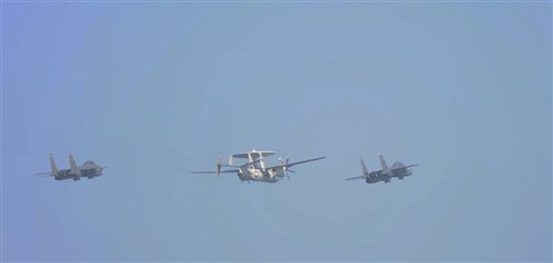 MEDITERRANEAN SEA (August 15, 2013) - An E-2C Hawkeye, assigned to Airborne Early Warning Squadron 126 “Seahawks,” accompanies a pair of U.S. Air Force F-15Es, assigned to the 492 Strike Fighter Squadron “Strike Eagles,” currently deployed to RAF Lakenheath, England, for a fly over of aircraft carrier USS Harry S. Truman (CVN 75). Harry S. Truman, flagship for Harry S. Truman Carrier Strike Group, is deployed supporting maritime security operations and theater security cooperation efforts in the U.S. 6th Fleet area of responsibility.