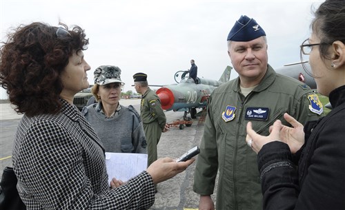 GRAF IGNATIEVO AIR FORCE BASE, Bulgaria -- Col. David Walker, 31st Operations Group and Thracian Star 2012 detachment commander, speaks to a journalist from the Bulgarian Telegraph Agency through a translator April 18, 2012 during the opening ceremony for the month-long joint training exercise focused on building partnerships and increasing interoperability with the Bulgarian air force. Bulgarian and American senior officials took the opportunity to acknowledge and express appreciation for the long-standing partnership between the two nations. 