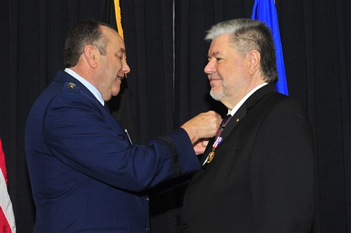 Gen. Philip M. Breedlove, United States Air Forces in Europe and Air Forces Africa commander, presents former Minister President Kurt Beck the U.S. Air Forces in Europe Medal of Distinction on Ramstein Air Base, Germany, March 8, 2013. The USAFE Medal of Distinction is awarded to non-U.S. citizens in recognition of extraordinary service, achievements, or support to the accomplishment of the mission of USAFE. 