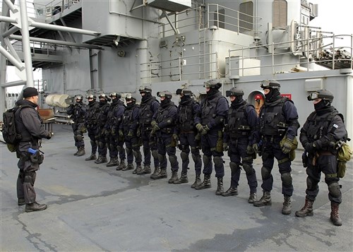 ABOARD USS MOUNT WHITNEY, Baltic Sea &mdash; A Finnish boarding team receives tactical instruction on the flight deck of USS Mount Whitney (LCC/JCC 20) as part of Baltic Operations (BALTOPS) exercise 2009, June 15. This is the 37th iteration of BALTOPS and is intended to improve interoperability with partner countries by conducting realistic training at sea with the 12 participating nations. (Department of Defense photo by Navy Mass Communication Specialist 3rd Class Christian T. Martinez)