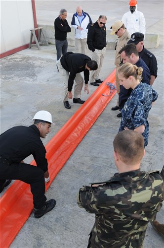 MARSA, Malta (Dec. 7, 2011) – Mark Zammit, leading assistance and rescue officer for Malta’s Civil Protection Department, explains how to properly use oil spill cleanup equipment during Eurasia Partnership Capstone (EPC) 2011. Participants for EPC 2011 include approximately 100 representatives from Azerbaijan, Bulgaria, Georgia, Greece, Malta, Romania, Ukraine and the United States, focused on strengthening maritime relationships between Eurasian nations. Training workshops range from maritime law enforcement, maritime search and rescue, marine environmental protection, leadership development courses for noncommissioned officers and, for the first time during EPC, advanced network-enabled maritime interdiction operations. 