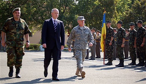 NIS, Serbia &mdash; Lt. Col. Goran Desancic, Serbian Armed Forces MEDCEUR 2009 co-director; Zoran Vesic, a Serbian state secretary; and Col. Tim Brown, 435th Contingency Response Group commander and U.S. MEDCEUR 2009 co-director(from left to right), walk past members of the Ukrainian military during the opening ceremony for MEDCEUR 2009, or the military medical training exercise in Central and Eastern Europe. More than 15 nations will participate in the exercise scheduled for Sept. 2-13. (Department of Defense photo by Air Force Senior Airman Kali L. Gradishar)