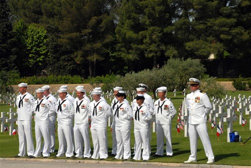DRAGUIGNAN, France &mdash; Sailors assigned to Naval Station Rota, Spain stand at parade rest during a Memorial Day ceremony at Rhone American Cemetery here, May 24. Forty Marines, Sailors and Airmen from Rota, participated in the event to honor the 861  U.S. soldiers, sailors, airmen and Marines from World War II interred at the cemetery. (Department of Defense photo by Navy Mass Communication Specialist 1st Class Paul Cage)