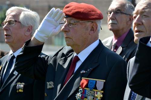 A French veteran salutes during the playing of the French and U.S. national anthems during a Memorial Day ceremony at Saint-Quentin, France. During World War I, the U.S. military suffered roughly 7,500 casualties on the attack of the Hindenburg Line, in the sector just north of Saint-Quentin, France. U.S. Soldiers from Germany-based 5th Signal Theater Strategic Command were guests at Saint-Quentin’s Memorial Day event, May 27, 2012. 