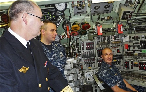 Haakonsvern, Norway (October 11, 2011) - Rear Adm. Bernt Grimstvedt, chief of the Royal Norwegian Navy, speaks with Sailors from the Los Angeles-class submarine USS Miami (SSN 755) while inport Haakonsvern, Norway. Grimstvedt toured Miami during its scheduled port visit to strengthen maritime partnership with Norwegian counterparts.