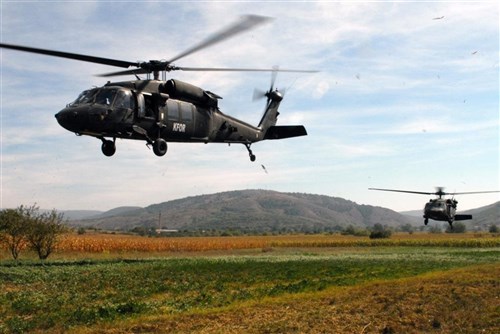 Two UH-60 Blackhawk helicopters land in a field in Crep/Crepana, Kosovo, during a Quick Reaction Force training exercise, Sept. 18. The helicopters were used to deploy and extract Armenian soldiers. (U.S. Army photo by Pfc. Brian J. Holloran, 130th Public Affairs Detachment, Connecticut National Guard)