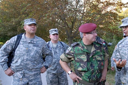 Portuguese Army Brig. Gen. Marco Serronha, deputy commander, KFOR, visited three different municipalities during his visit with the Liaison Monitoring Team, Multinational Battle Group East, Sept. 14. 1st Lt. Octavio Perez, LMT 1 officer in charge, explained to Serranho about the many different issues that face the people living in the municipality of Kamenica/Kamenice. Lt. Col. Jose Boria, Juncos, Puerto Rico, deputy commander, Multinational Battle Group East, and Maj. Higinio Figueroa, Las Piedras, Puerto Rico, commander of the 192nd LMT, were able to join Brig. Gen. Serranha during his day. 1st Lt. Perez and Maj. Figueroa are members of the Puerto Rico National Guard.  (U.S. Army photo by Pfc. Sarah A. Cummings, 130th Public Affairs Detachment, Connecticut National Guard)