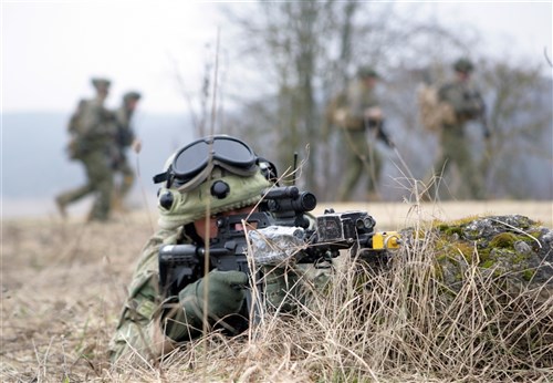 HOHENFELS, Germany, (Feb. 20, 2011) -A Georgian soldier assigned to the 33rd Light Infantry Battalion provides security during a training patrol at the Joint Multinational Training Center, here. The soldier is participating in the Georgia Deployment Program- Mission Readiness Exercise, where a majority of the Marines serving as observer/controllers were from 3rd Bn, 7th Marine Regiment, mentoring the 33rd LIB before they head to Afghanistan this spring.