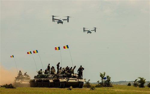 U.S. Marine MV-22B Ospreys from Special-Purpose Marine Air-Ground Task Force Crisis Response-Africa departed Mihail Kogălniceanu Air Base, Romania, with a platoon of Marines from the Black Sea Rotational Force to support a multilateral training exercise during Platinum Eagle 15, May 26, 2015.  The Ospreys left Morón Air Base, Spain, earlier in the week, and arrived to work with their allies from the Bulgarian and Romanian armed forces.  The Ospreys delivered the Marines to the Babadag Training Area, where they demonstrated their ability to conduct security operations. The training represents the first time Ospreys have conducted multilateral training in Romania, where members of BSRF have established a growing relationship with partner Romanian forces. (U.S. Marine Corps photo by Sgt. Paul Peterson/Released)