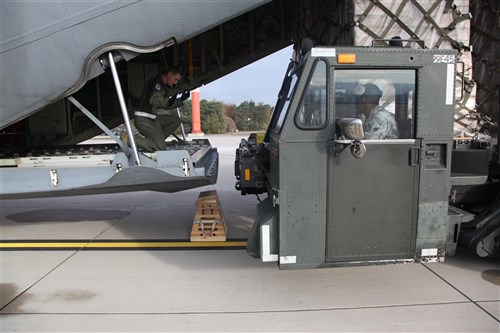 Members of the 37th Airlift Squadron, Blue-Tail Fliers, out of Ramstein AB, Germany, load supplies onto a C-130 Hercules (Christine)  on Oct. 29, 2011 on Ramstein AB, Germany. The purpose of the supplies is to aid in the relief efforts for the earthquake that devastated the country of Turkey. 