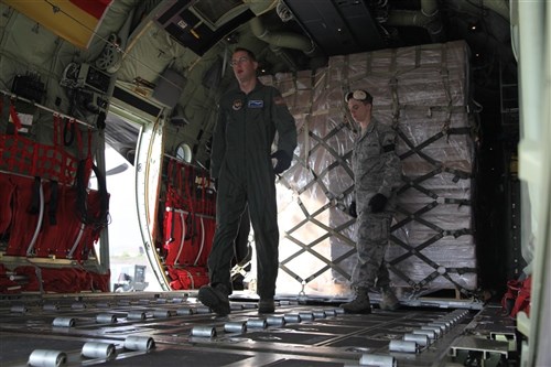 Members of the 37th Airlift Squadron, Blue-Tail Fliers, out of Ramstein AB, Germany, load supplies onto a C-130 Hercules (Christine)  on Oct. 29, 2011 on Ramstein AB, Germany. The purpose of the supplies is to aid in the relief efforts for the earthquake that devastated the country of Turkey. 