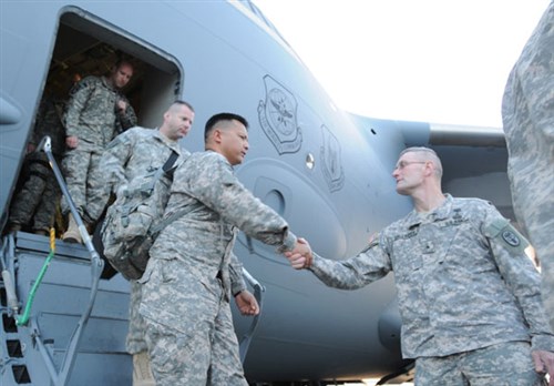 RAMSTEIN AIR BASE, Germany &mdash; Army Lt. Col. Rodrigo Chavez Jr. is welcomed home by Army Brig. Gen. Keith Gallagher, the Europe Regional Medical Command commander April 26. Chavez, and the soldiers of Task Force 30th MEDCOM, returned from a 12-month deployment in support of Operation Enduring Freedom April 26. (Department of Defense photo)