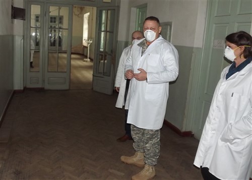 Sergeant 1st Class John Newland (center), U.S. European Command Interagency Partnering Directorate Civil Affairs Noncommissioned Officer in Charge and Dr. Cate Johnson (right), U.S. Agency for International Development’s senior advisor to USAID tour the tuberculosis hospital in Abastumani, Georgia, Jan. 24, 2014, with David Raminashvili, USAID implementing partner to assess the government’s ability to treat and respond to TB. This building was built in the early 19th Century by Tsar Nikolas II and as a TB hospital can treat up to 65 of the estimated 2,500 infected in the region it serves. 