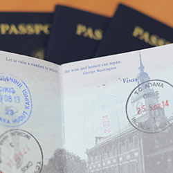 An open passport with stamps on it