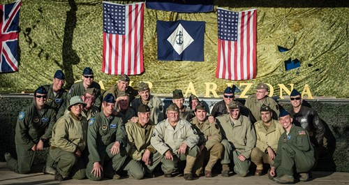 Members of the 37th Airlift Squadron pose with World War II re-enactors in Caretan, France, June 4, 2014. More than 60 Ramstein Airmen have traveled to Normandy, France, to celebrate and honor the sacrifices made by veterans of World War II.