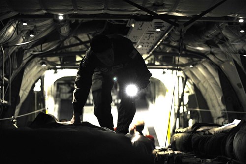 Tech. Sgt. Kepa Kahihikolo, 37th Airlift Squadron loadmaster, checks over the loaded ten-bundle container deployment system in the cargo bay of a C-130J Super Hercules, March 16, 2012 at Ramstein Air Base, Germany. The cargo was dropped in order to support field-training exercises for the 173rd Airborne Brigade Combat Team from Vicenza, Italy. This training gave pilots and loadmasters here an opportunity to practice this type of airdrop.
