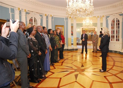 WASHINGTON, D.C. - Secretary of State Hillary Clinton meets with participants of a workshop, titled "Leaning Forward: Gender Mainstreaming in African Armed Forces," September 14, 2012. The workshop brought together more than two dozen experts and practitioners from 14 African countries, the African Union, Inter-governmental Authority on Development (IGAD), and the United States government to examine and highlight the progress made, challenges experienced, as well as the opportunities available to enhance gender mainstreaming in African security forces. (Photo courtesy of Africa Center for Strategic Studies)