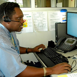 Reservist working at a desk for his civilian job