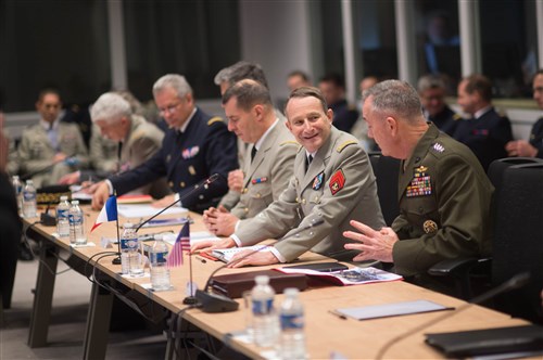 U.S. Marine Corps Gen. Joseph F. Dunford Jr., right, chairman of the Joint Chiefs of Staff, and Gen. Pierre de Villiers, chief of France's defense staff, talk during a meeting at the French defense headquarters in Paris, Jan. 22, 2016