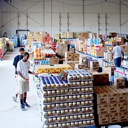 Pallets of food in a warehouse set up for temporary shopping