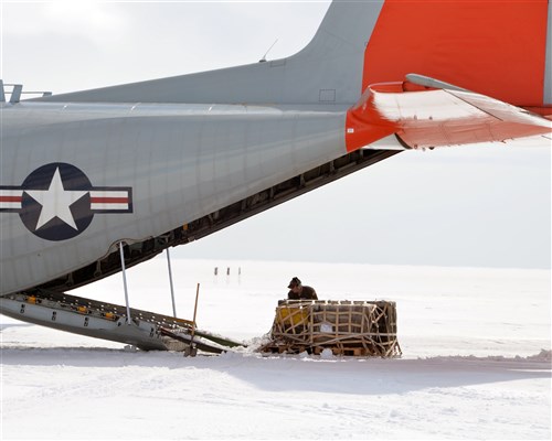 New York Air National Guard Staff Sgt. Matthew Jones, 109th Airlift Wing LC-130 "Skibird" Loadmaster clears snow from a pallet being uploaded onto a LC-130 "Skibird at Camp Raven, Greenland, on June 28, 2016.An LC-130 "Skibird" from the New York Air National Guard's 109th Airlift Wing in Scotia, New York, lands at Camp Raven, Greenland, near the DYE-2 site, on June 28, 2016. Crews with the 109th AW use Camp Raven as a training site for landing the ski-equipped LC-130s on snow and ice. Four LC-130s and  80 Airmen from the Wing recently completed the third rotation of the 2016 Greenland season.