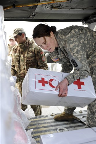 PODGORICA, Montenegro -- Spc. Monique Bumstead a crew chief from U.S. Army Europe’s 1st Battalion 214th Aviation Regiment, 12th Combat Aviation Brigade, works with her Montenegrin partners to load Red Cross supplies for a humanitarian relief mission Feb. 22. The Soldiers are part of the U.S. task force sent to provide humanitarian assistance at request of the government of Montenegro coordinating with the National Emergency Operations Center and the Montenegrin Ministry of Defense to provide relief and to save lives, homes and infrastructure in response to heavy snowfall.