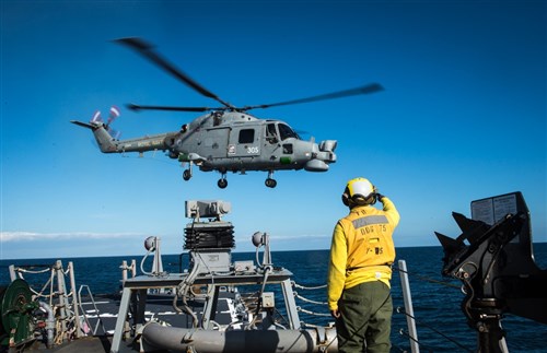 USS Donald Cook (DDG 75) conducts flight quarters with a United Kingdom Royal Navy Lynx Helicopter, March 25, 2015. Donald Cook, an Arleigh Burke-class guided-missile destroyer forward-deployed to Rota, Spain, is conducting naval operations in the U.S. 6th Fleet area of operations in support of U.S. national security interests in Europe. (U.S. Navy photo by Mass Communication Specialist 2nd Class Karolina A. Oseguera/Released)
