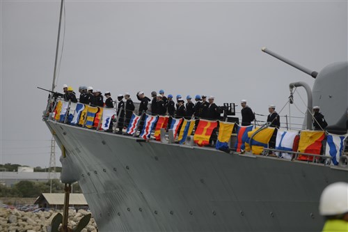 ROTA, Spain (Feb. 11, 2014) Sailors aboard the guided-missile destroyer USS Donald Cook (DDG 75) man the rails as the ship arrives in Rota, Spain. Donald Cook is the first of four Arleigh Burke-class guided-missile destroyers to be stationed in Rota. 