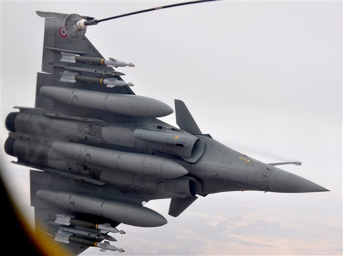 A French fighter aircraft rolls left away from a KC-135 Stratotanker March 17, 2013, over Africa. The 351st Expeditionary Air Refueling Squadron, which flies the tankers, completed the 100th refueling mission of French fighter aircraft conducting operations over Mali. Airmen and aircraft from the 100th Air Refueling Wing, RAF Mildenhall, England, deployed as the 351st EARS to a location in southwest Europe on Jan. 26, 2013. (U.S. Air Force photo by Captain Jason Smith)