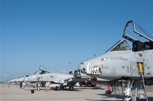 Eight U.S. Air Force A-10 Thunderbolt IIs assigned to the 442nd Fighter Wing, Whiteman Air Force Base, Missouri, park on the runway as maintainers perform post-flight inspections at Ämari Air Base, Estonia, July 25, 2016. The A-10s are participating in a flying training deployment with the Estonian air force to enhance mutual capabilities and increase interoperability. After more than two weeks of training with British forces, the A-10s flew to Estonia from Royal Air Force Leeming, England. (U.S. Air Force photo by Senior Airman Missy Sterling/released)